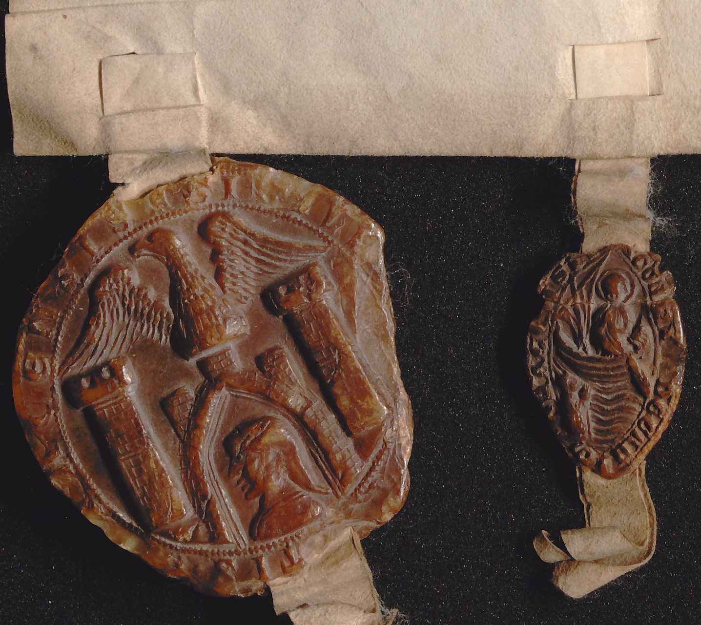 Siegel des Münchner Stadtrats und von Dekan Konrad Wildbrecht an der Stiftungsurkunde von 1284